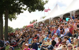 A crowd gathers on the banks of the Grand Prix Field at Old Salem Farm; photo © Jump Media