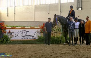 Katherine Bundy, aboard Co Co Pop, with trainers John Brennan, Maggie Gampher, and Kelly Wilson, and groom Roberto Rodriguez are presented as winners of the Region 1 ASPCA/NHSAA Maclay Championship by Mason Phelps, representing the CP National Horse Show; photo © Jump Media