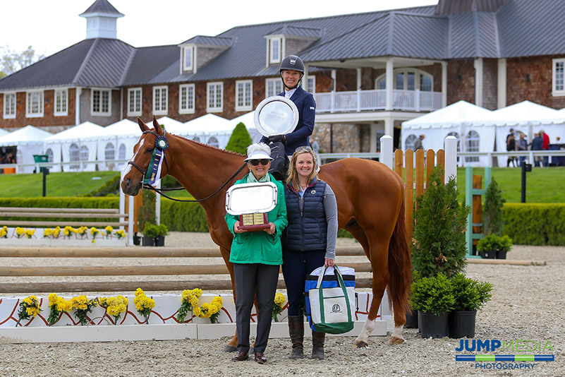 Left to right: Vivien Malloy and Caitlin Malloy Brennan present Lainie Wimberly with the Debby Malloy Winkler Memorial Trophy, donated by the Malloy Family, after Southern Charm jumped to champion honors in The Jockey Club Thoroughbred Incentive Program (T.I.P.) $2,000 Low Thoroughbred Hunter 3' Division during the Old Salem Farm Spring Horse Shows Welcome Day at Old Salem Farm in North Salem, NY; photo © Jump Media