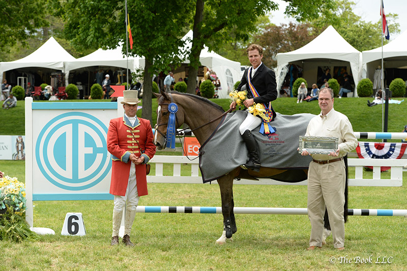 Michael Fitzgibbon, Executive Manager of Sales at Douglas Elliman, presents Shawn Casady and Vanilla as winners of the $15,000 Under 25 Grand Prix, presented by Douglas Elliman Real Estate, during the 2017 Old Salem Farm Spring Horse Shows at Old Salem Farm in North Salem, NY. Photo by The Book