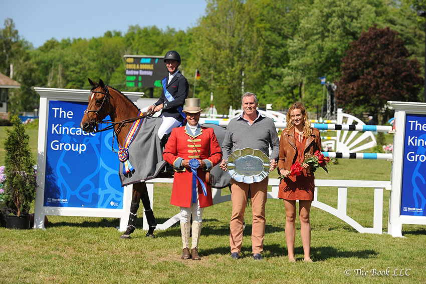 Stephen Kincade, founder of The Kincade Group, and his daughter Gretchen presented Andrew Ramsay and Cocq a Doodle as winners of the $130,000 Empire State Grand Prix CSI3*, presented by The Kincade Group, at the 2017 Old Salem Farm Spring Horse Shows at Old Salem Farm in North Salem, NY. Photo by The Book