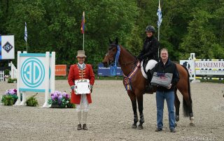 Beezie Madden and Jiva are presented as winners of the $35,000 Old Salem Farm Jumper Classic, presented by Douglas Elliman Real Estate, by Michael Fitzgibbon, Executive Manager of Sales at Douglas Elliman, on Saturday, May 19, during the 2018 Old Salem Farm Spring Horse Shows at Old Salem Farm in North Salem, NY. Photo by The Book